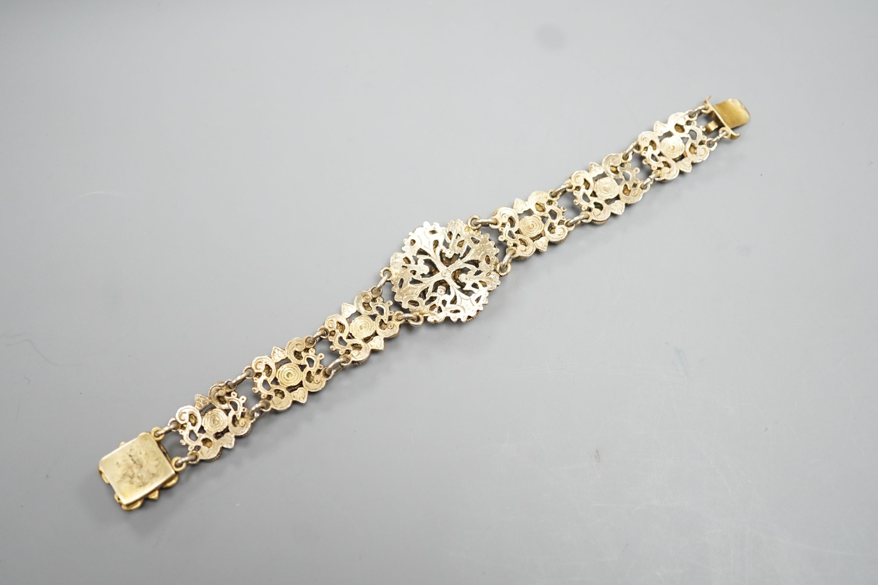 A late 19th/early 20th century Austro-Hungarian gilt white metal and blue paste set bracelet, 15.8cm.